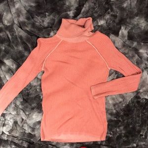 Salmon colored long sleeve turtleneck
